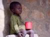 African child with red cup
