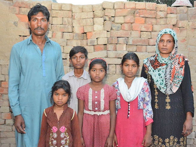 Munir and Nadia with their son and three daughters, before the family had been freed
