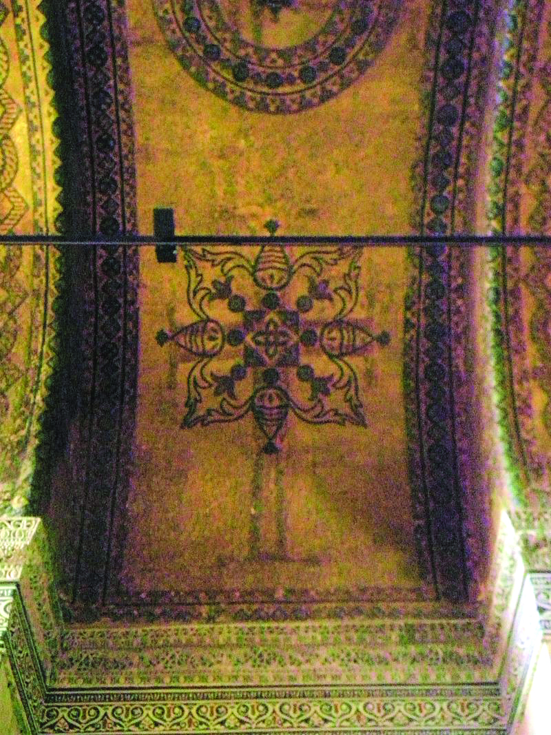 Some original Christian paintings of crosses are still visible on the ceiling of Hagia Sofia despite later Islamic decoration