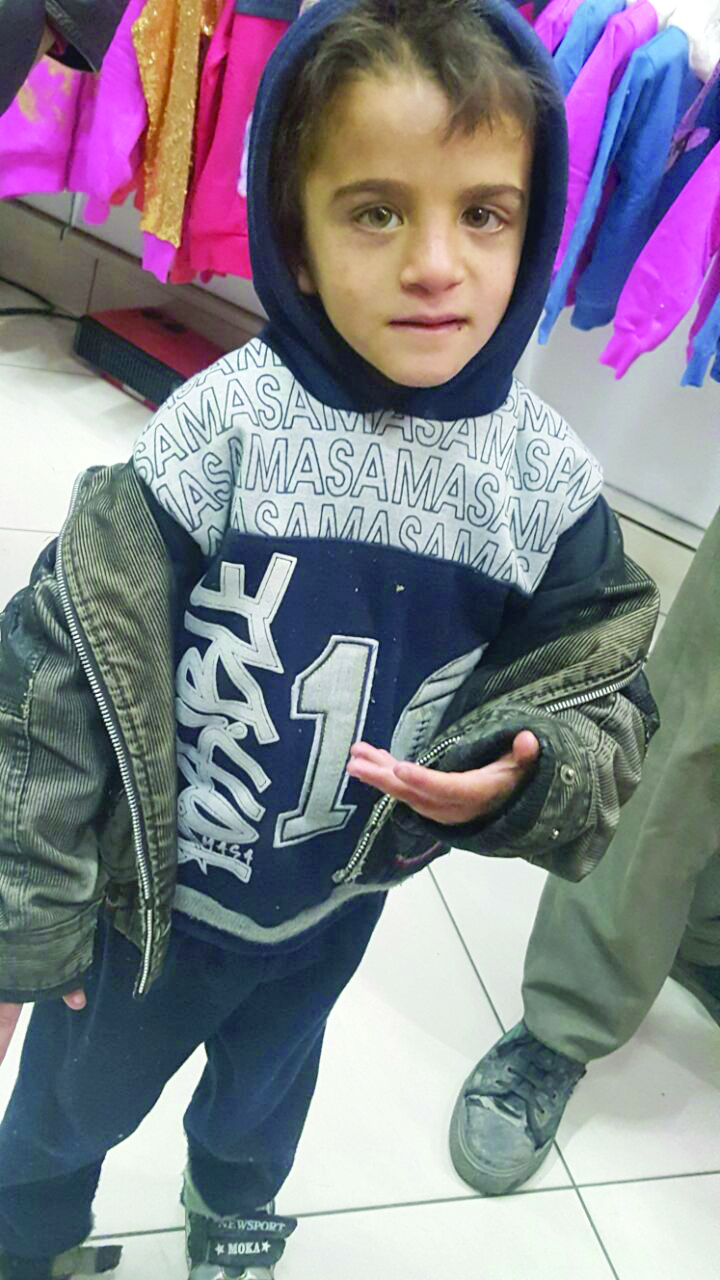 Syrian Christian boy with new warm winter clothes provided by Barnabas