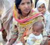 Pakistan woman holding baby